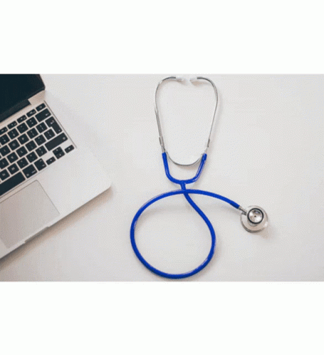 a laptop with a stethoscope on it next to a computer