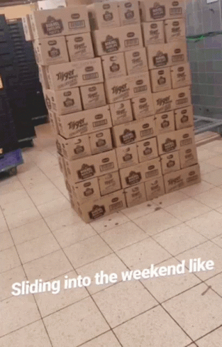 there is some boxes stacked on a tile floor
