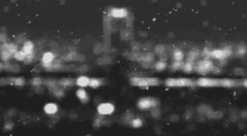 blurry po of a nighttime city view with traffic