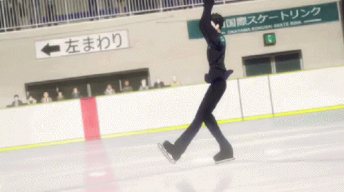 a person standing on an ice rink skating