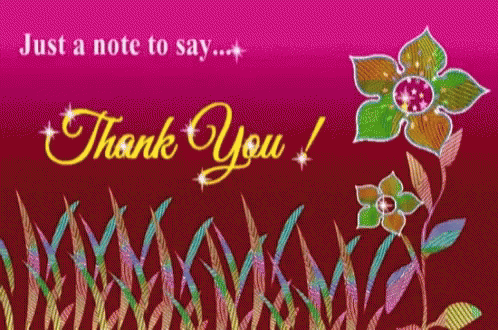 a flower and some grass and a thank you sign