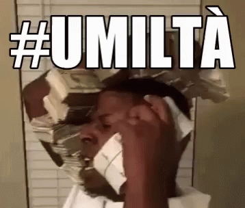 a person holding their head near a mirror that has the words umltta on it