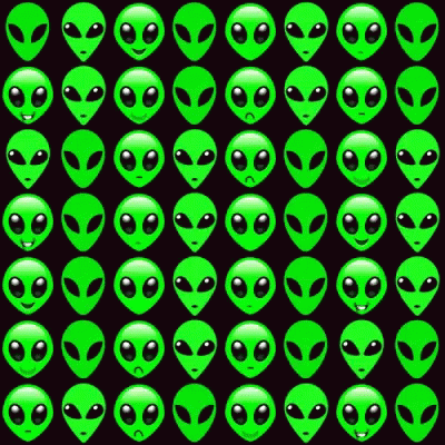 an alien looking wallpaper with green and black faces