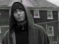 a black and white image of a person in the hood