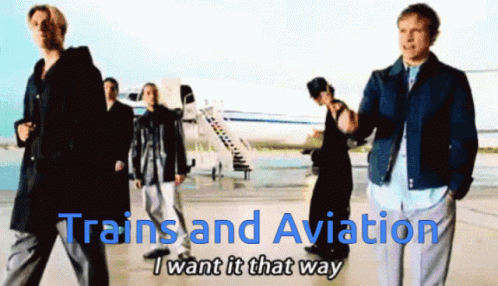 several people stand together outside of a plane