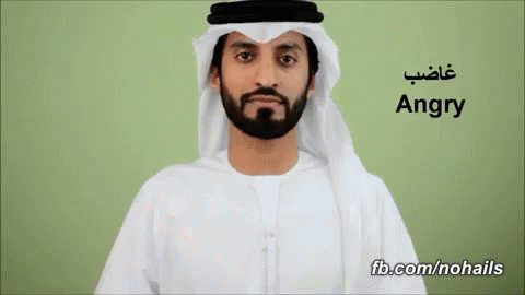 an arab man wearing an adult - style outfit with his name in an arabic script