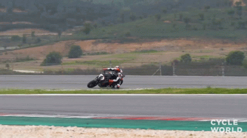person riding a motorcycle on a race track