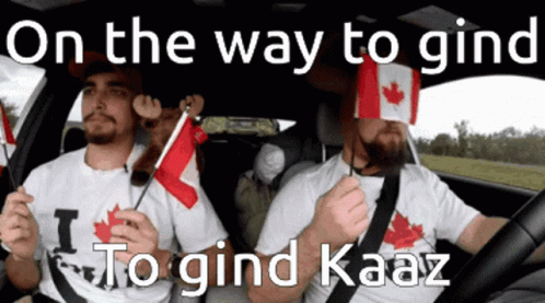 two men with canadian flags on their shirts, driving a car
