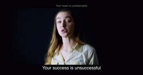 a young woman with white hair stands in a dark room and says, your success is unaccessfully