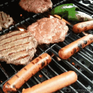 some blue colored food is cooking on a grill