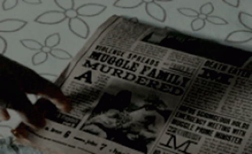 a close up of a newspaper on a bed