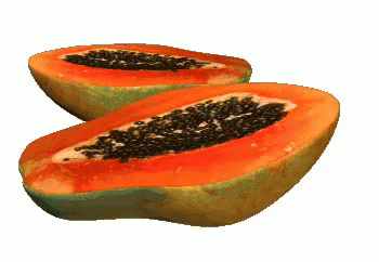 a couple of papaya slices with seeds on them