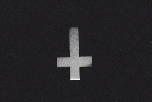 white cross on black background with words underneath