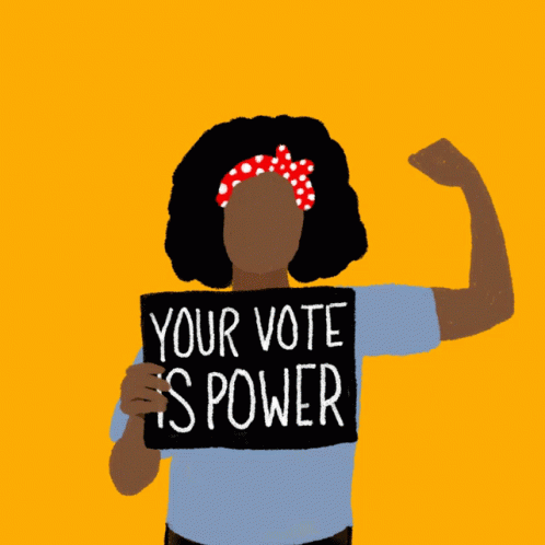 a woman holding a sign that says your vote is power
