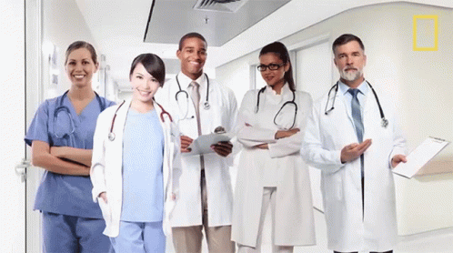 a group of doctors standing together for a po