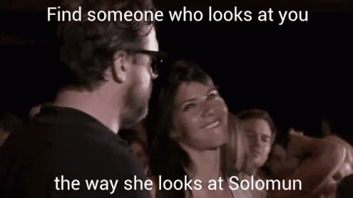 a girl and man smiling at each other while looking at soing