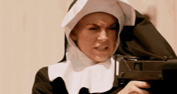 woman dressed in nun costume and holding gun looking down