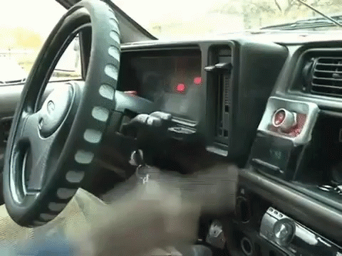 a view from inside a car shows the dashboard and dash
