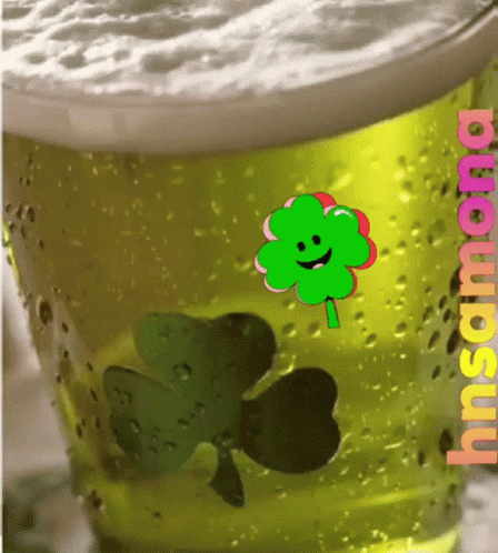 a close up view of the shamrock drink in a plastic cup