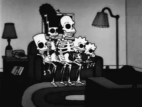 three skeletons and a lamp are in a room