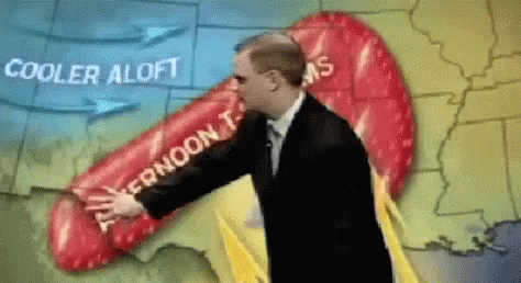 a newscast on cold day with the news reporter holding a weather balloon