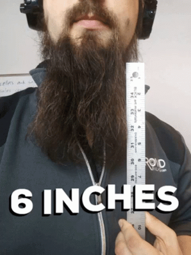 an advertit featuring a bearded man holding a ruler