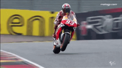 person riding a motorcycle on a racing track