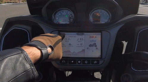 the inside view of a motorcycle with gpss and an arrow display