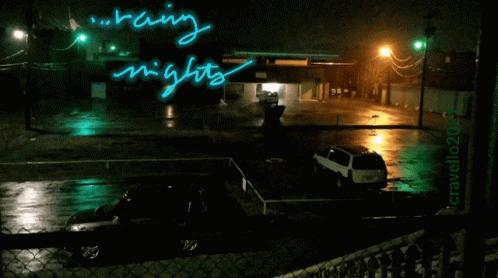 a rainy night on a parking lot in the dark