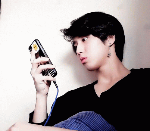 a person that is looking at a cell phone