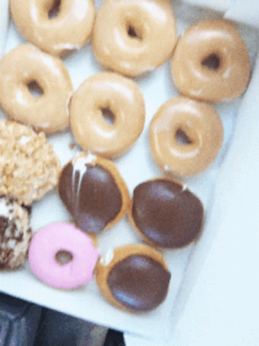 a bunch of doughnuts sitting on top of a table