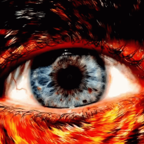 the eye of a person with a blue animal's pattern