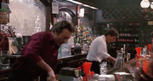 two people working at a bar area
