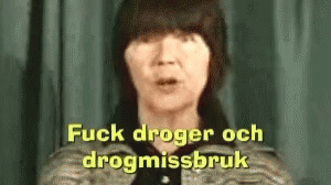 a woman with black hair wearing a jacket with text that reads f k dregen