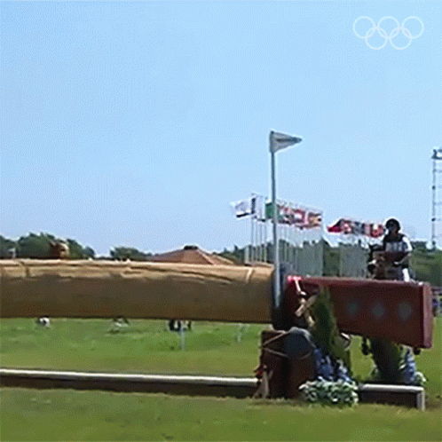 olympic performers on top of a giant bench