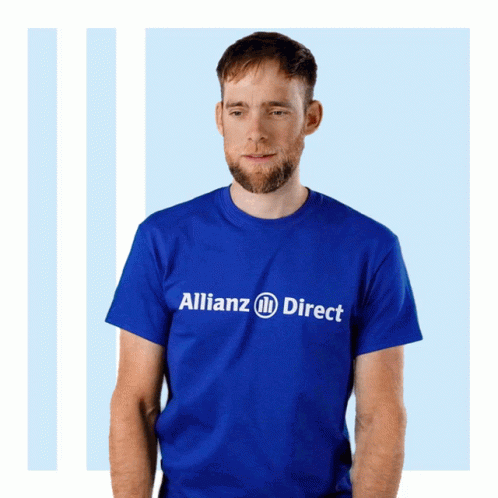 a man wearing an orange shirt with the words alliance direct printed on it