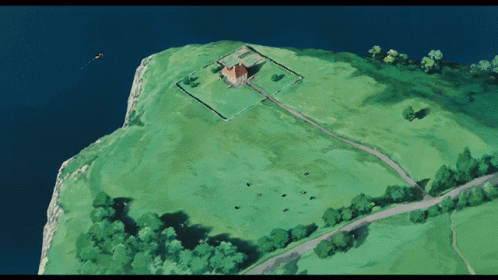 this is an aerial view of an older church on a hill