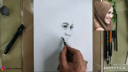 the artist uses crayon to draw a woman's face
