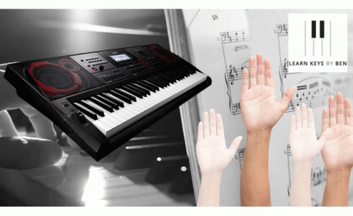 some hands holding soing out in front of a keyboard