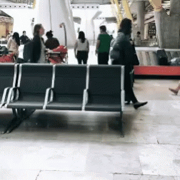 a couple of benches sit next to each other