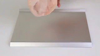 a soap dispenser next to a mirror