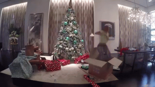 a living room with a christmas tree and presents