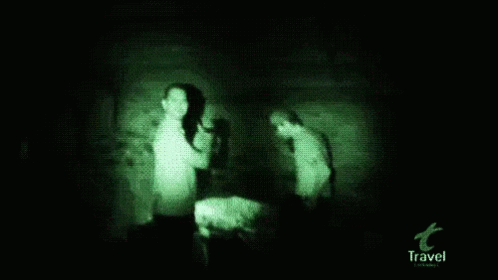 two women are in the dark of a room