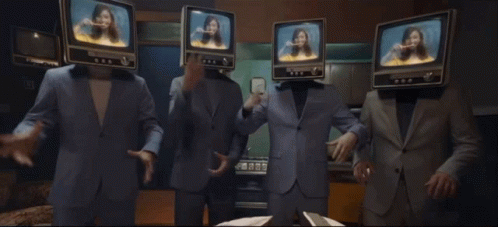 a television scene of three mannequins with faces on tv screens