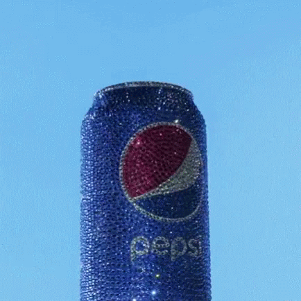 an upclose pepsi cola can with sequins and diamond wrappers