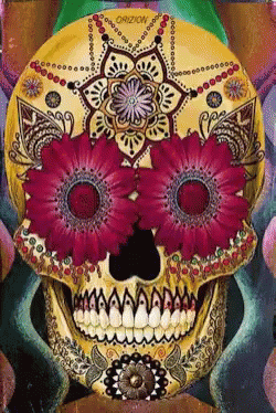 a po of a blue sugar skull painted with flowers