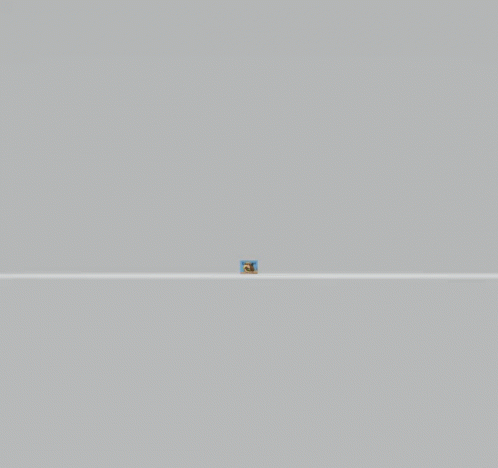 a blue square is in the middle of a gray wall