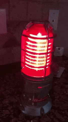 a bright blue light is on a small heater
