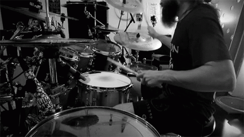 man with beard and drum in black and white pograph