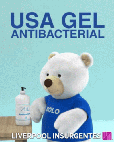 a stuffed bear holding up an item from the u s a gel antibacterial